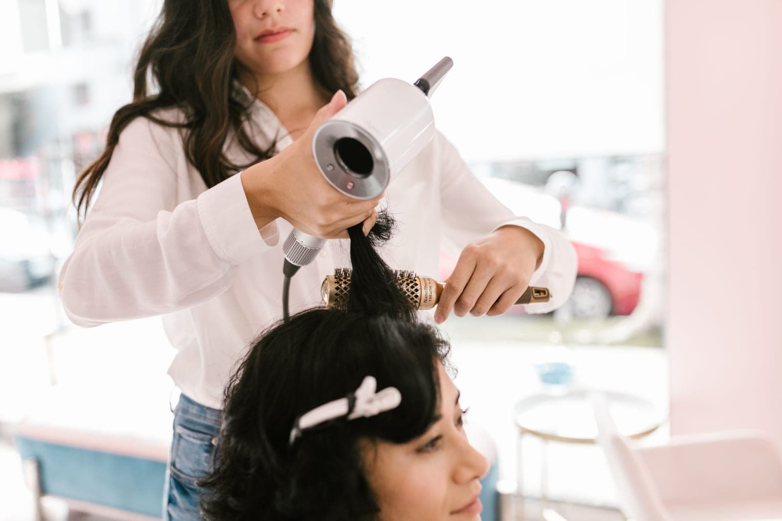 Natural curls being brushed and styled