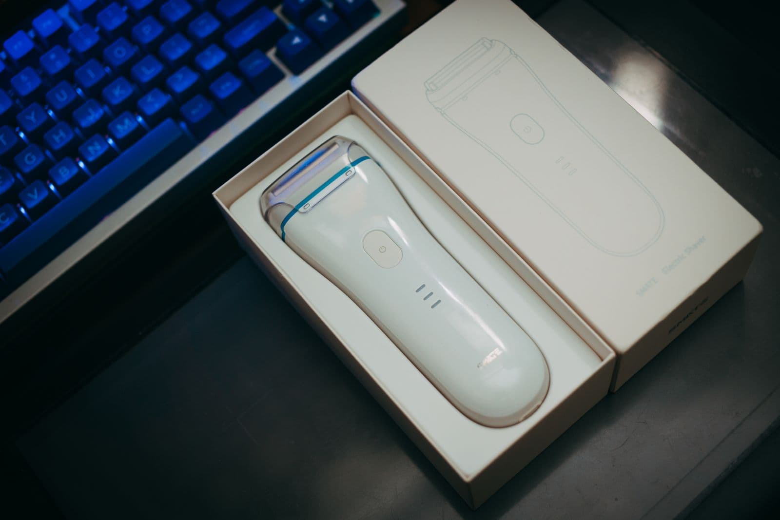 An electric shaver on a bathroom counter