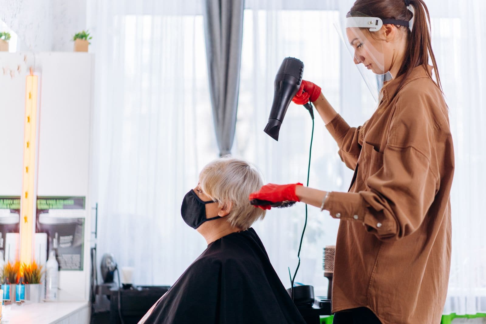 Two hair dryers side by side on a counter