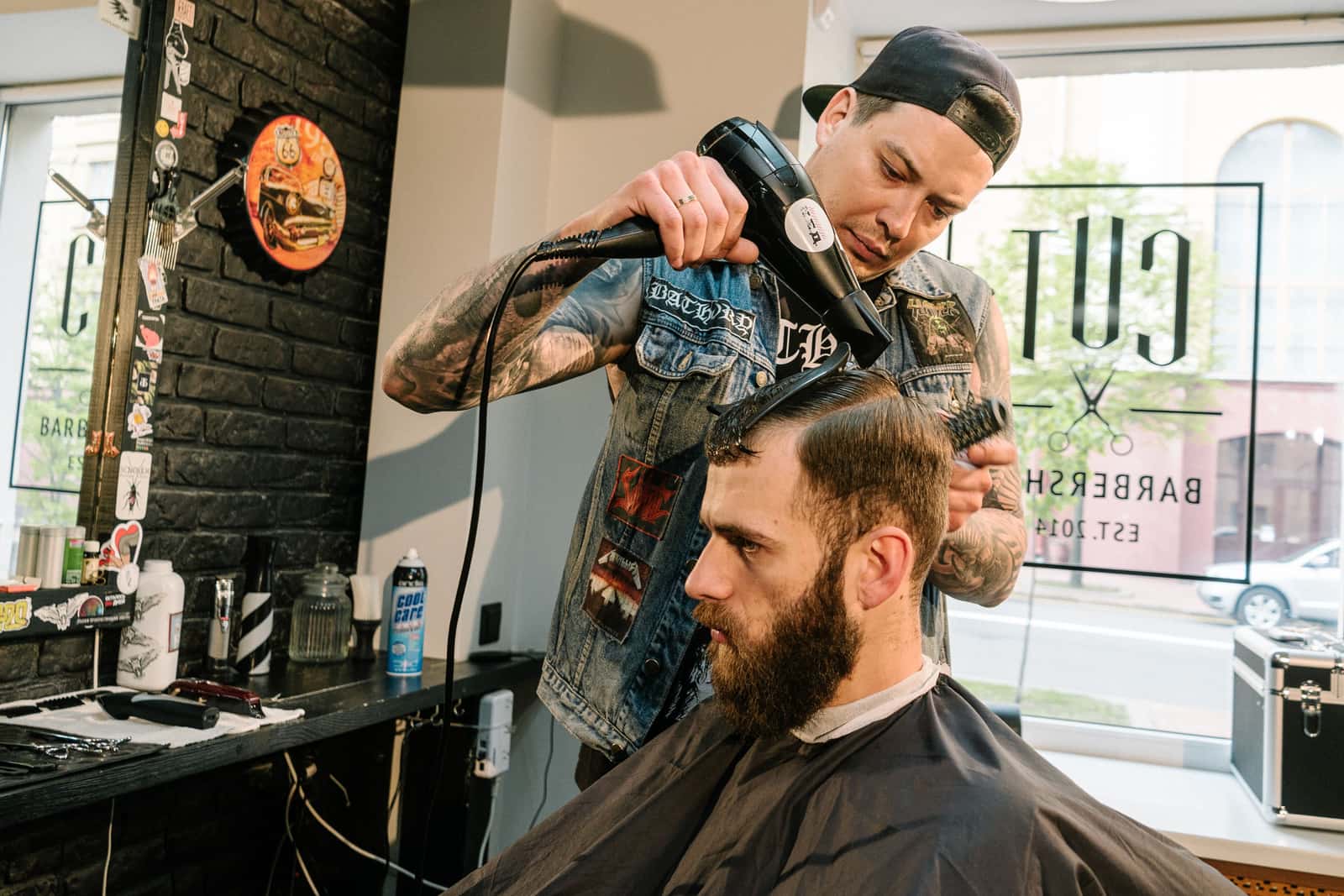 Short hair being blow dried in a barber shop