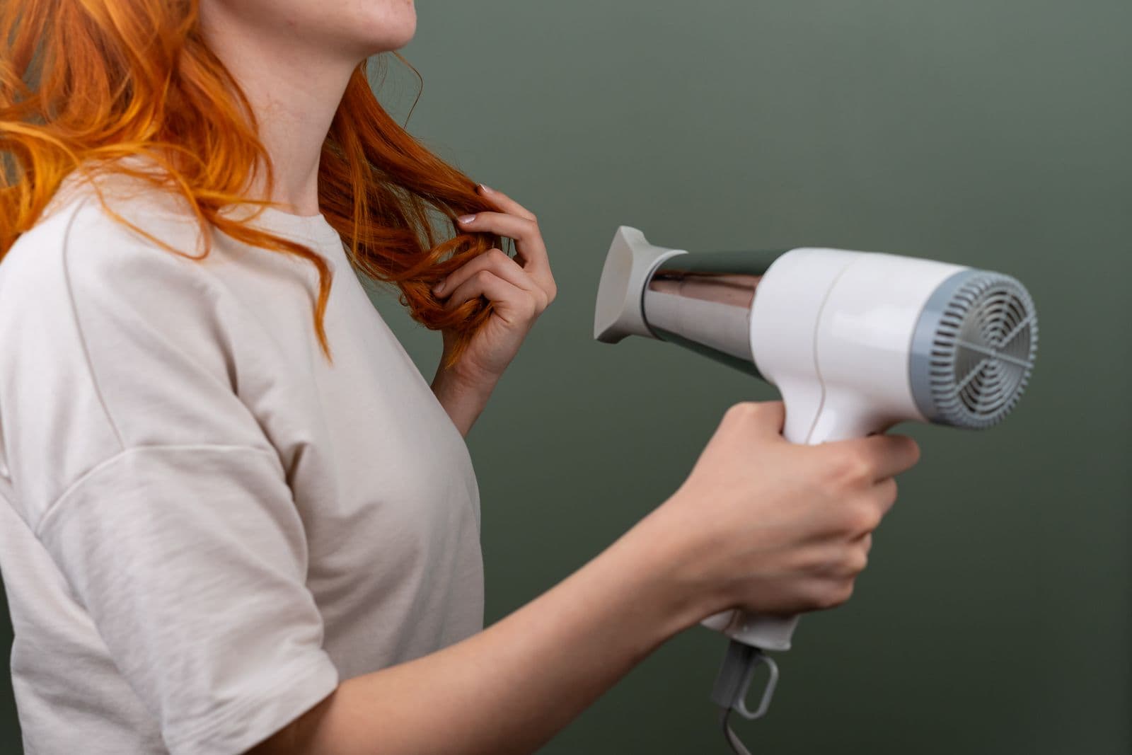 A hair dryer in use during a blow dry