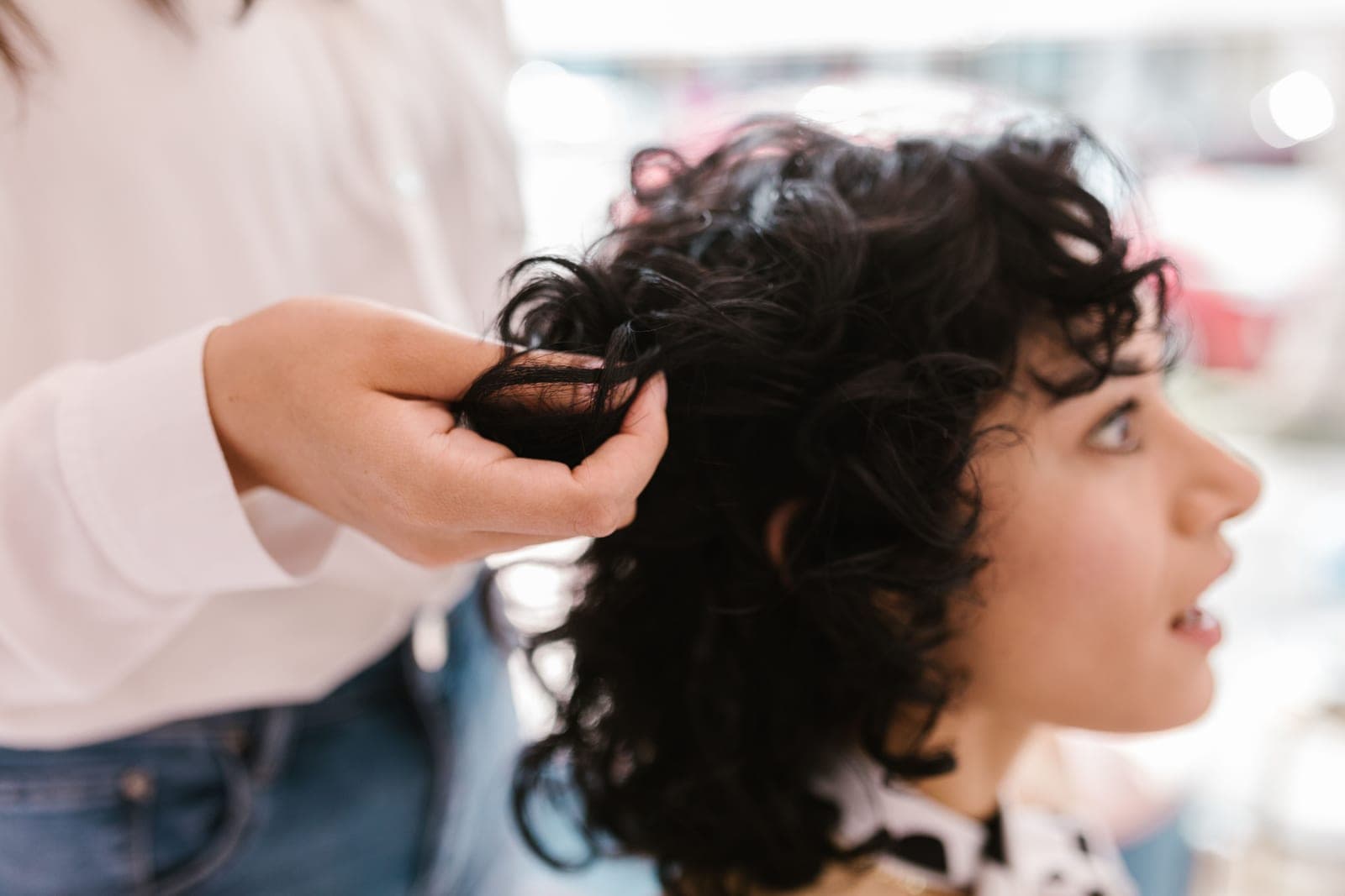 Wavy hair being styled in a salon