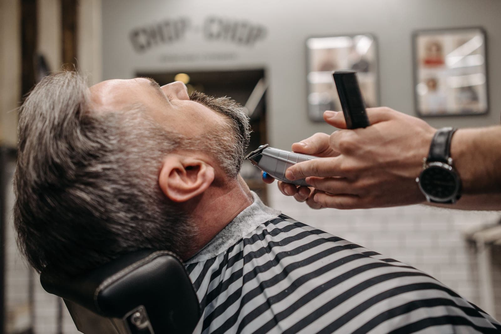 A beard trimmer close up during use