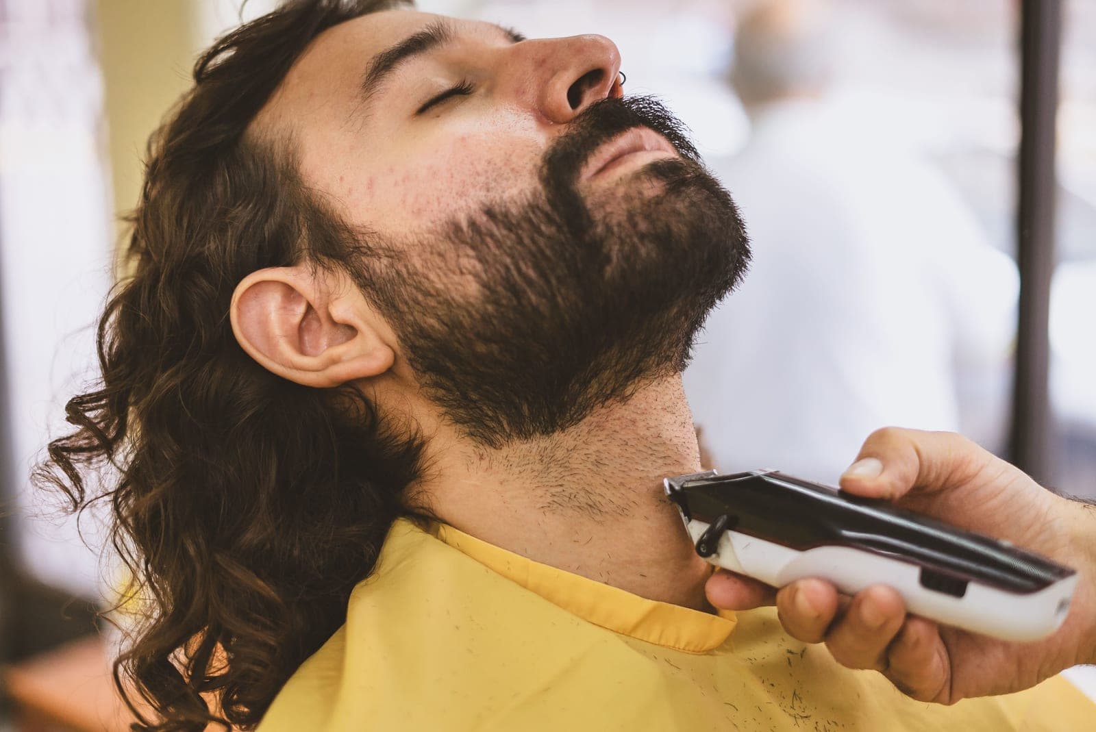 An electric shaver being used