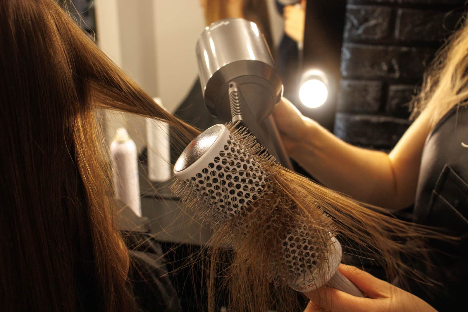Long hair being blow dried