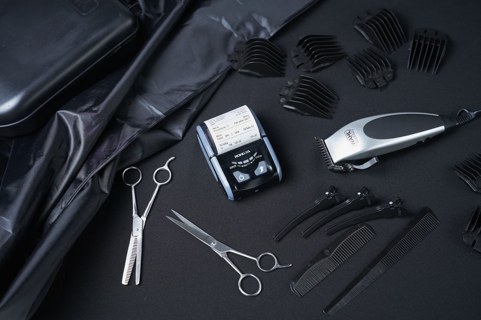 A collection of hair styling tools laid out