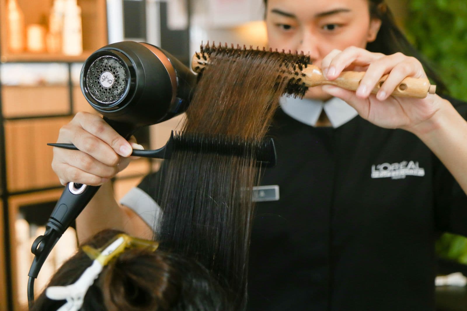 A heated styling brush on a counter