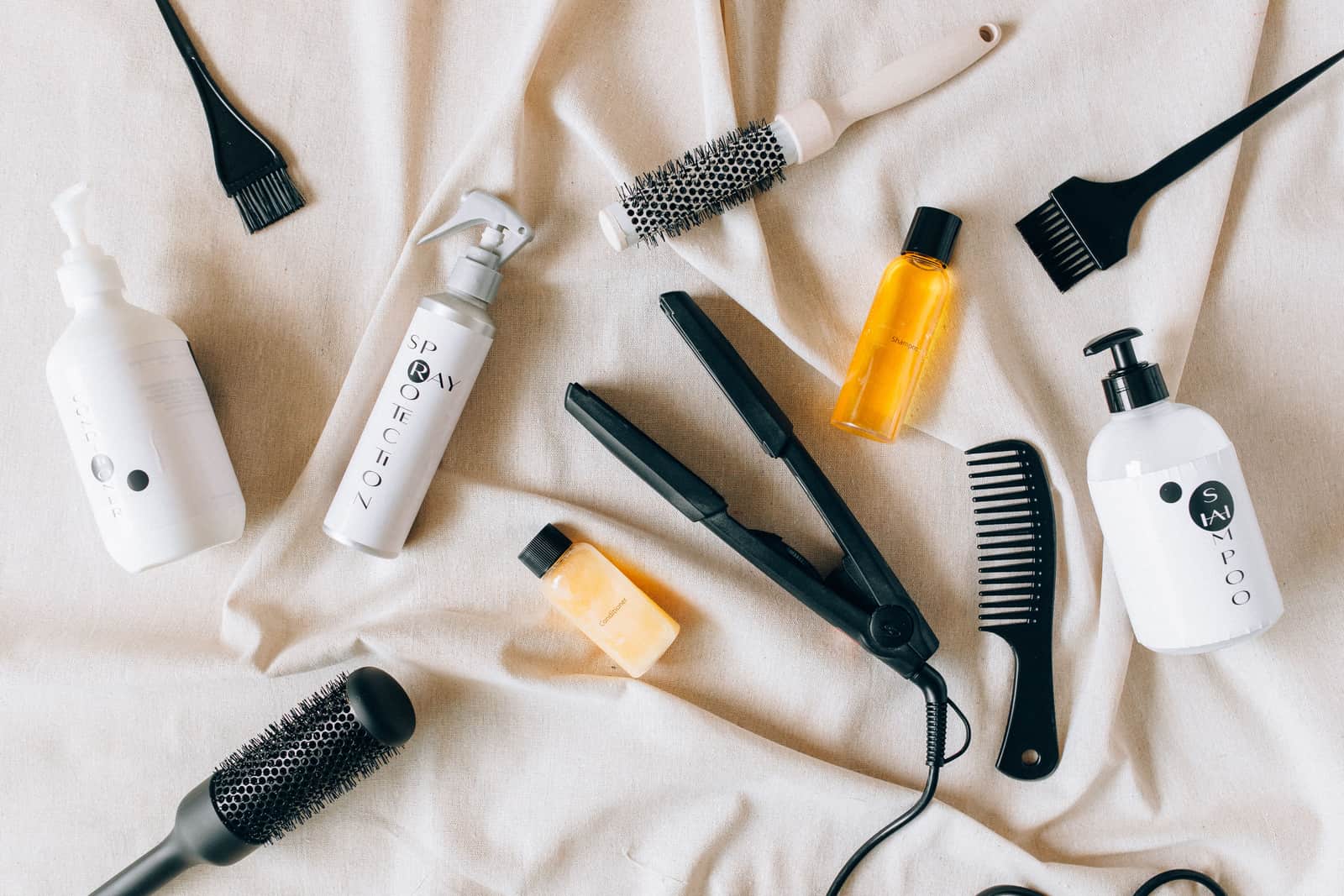 A straightening brush and comb on a surface
